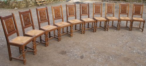a superb set of 10 french breton dining chairs