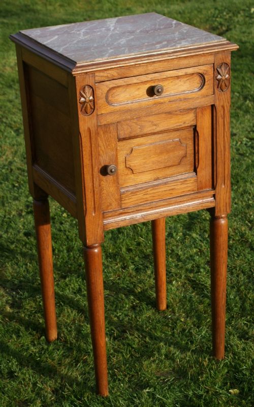a fine early 20th century french oak empire style bedside cabinet