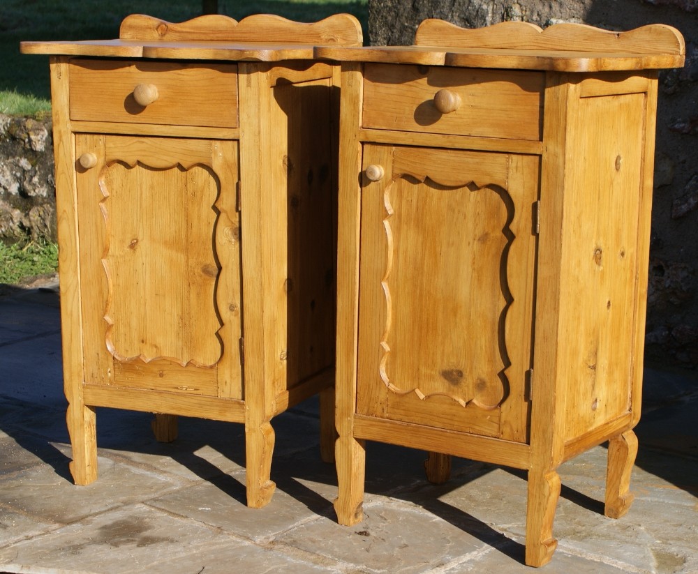 a pair of dutch stripped pine bedside cabinets