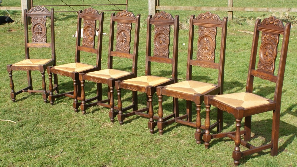 a stunning set of french breton carved oak dining chairs