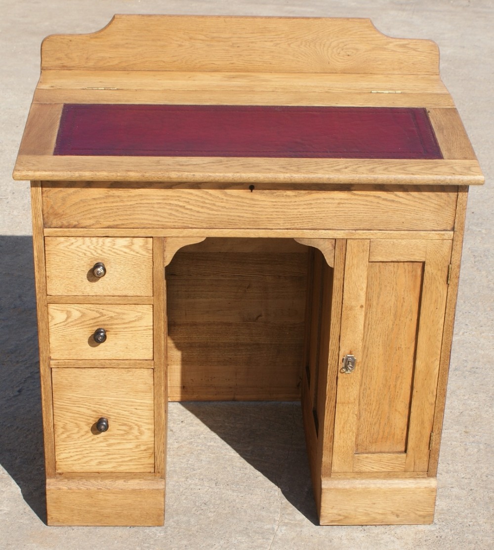 a very pretty little english oak ladies knee hole desk