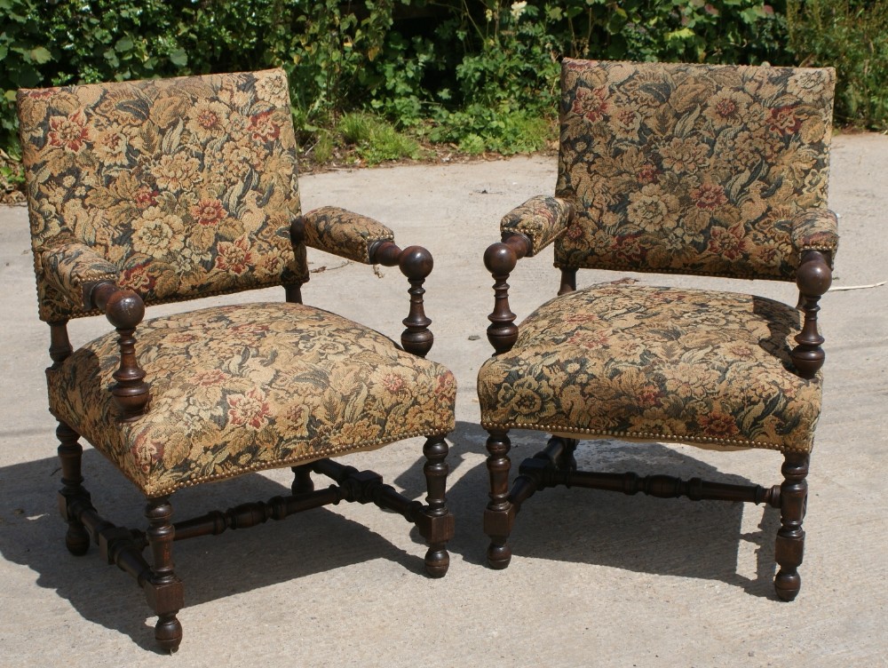 a pair of strong french early 20th century upholstered arm chairs