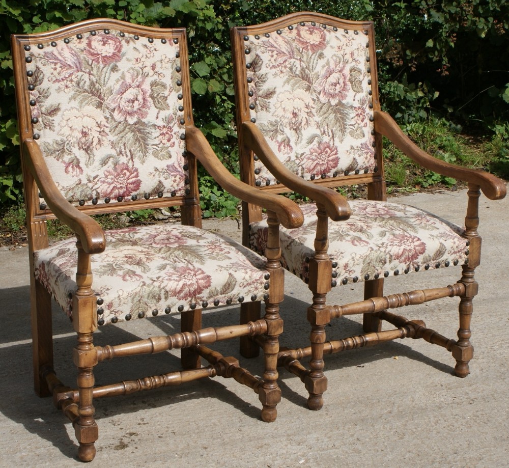 a pair of strong french early 20th century upholstered arm chairs