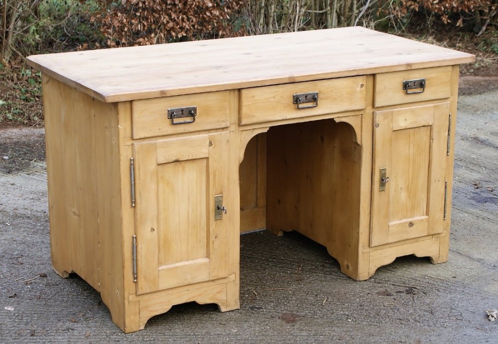a beautiful imposing antique german stripped pine knee hole desk