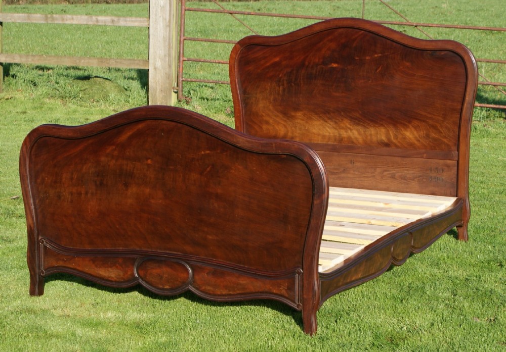 an late 19th century french mahogany veneer double bed with base