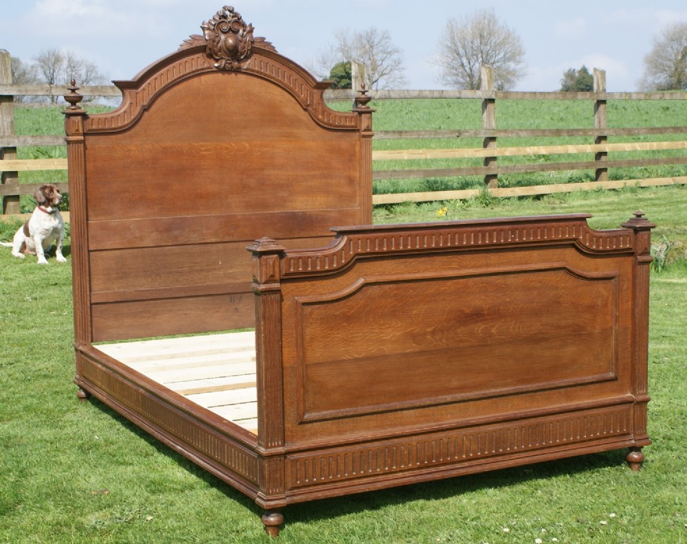 an late 19th century french solid oak double bed with base